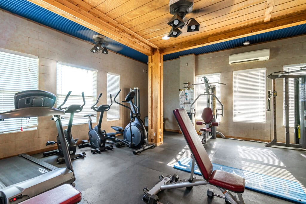 Gym with exercise equipment at New Hope Ranch
