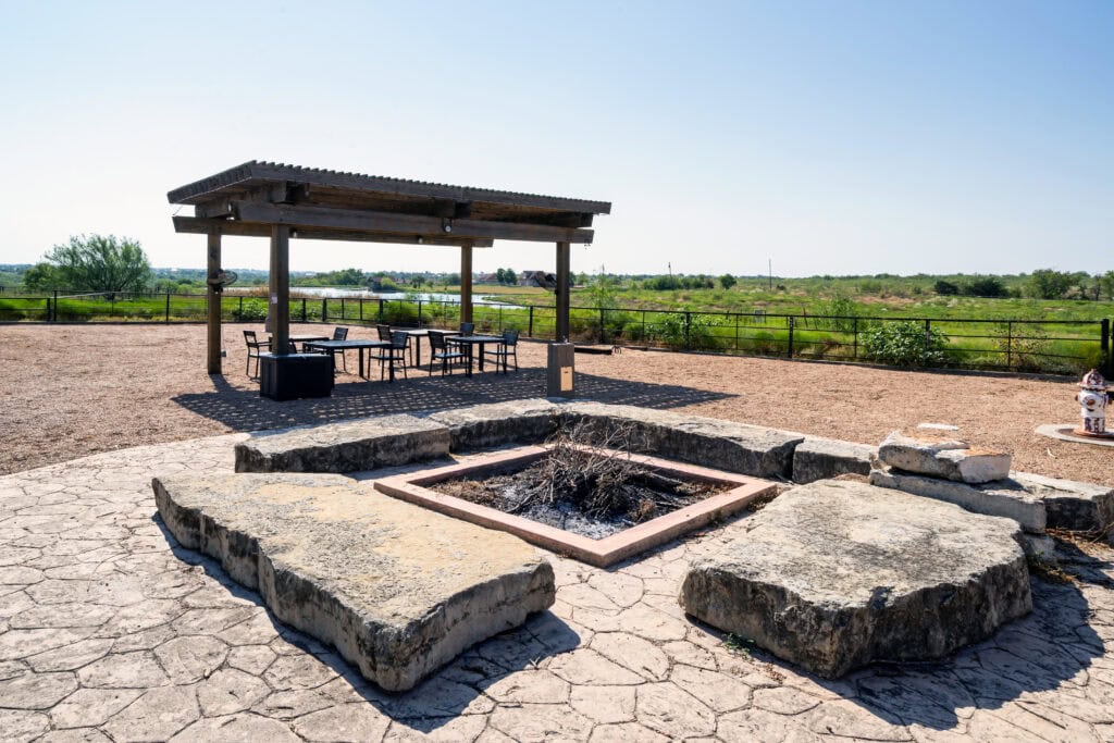 Fire pit and shaded pavilion in the outdoor recreation area