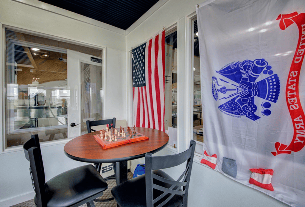 Veterans lounge with American and U.S. Army flags