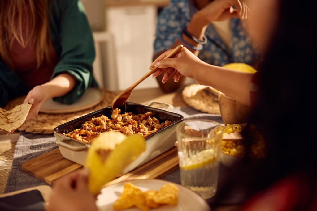 Friends sharing a taco dinner around a table